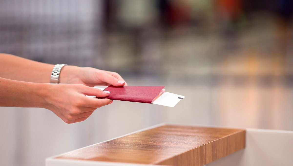Passports and a boarding pass, close