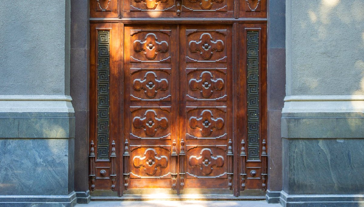 A carved door, firmly closed