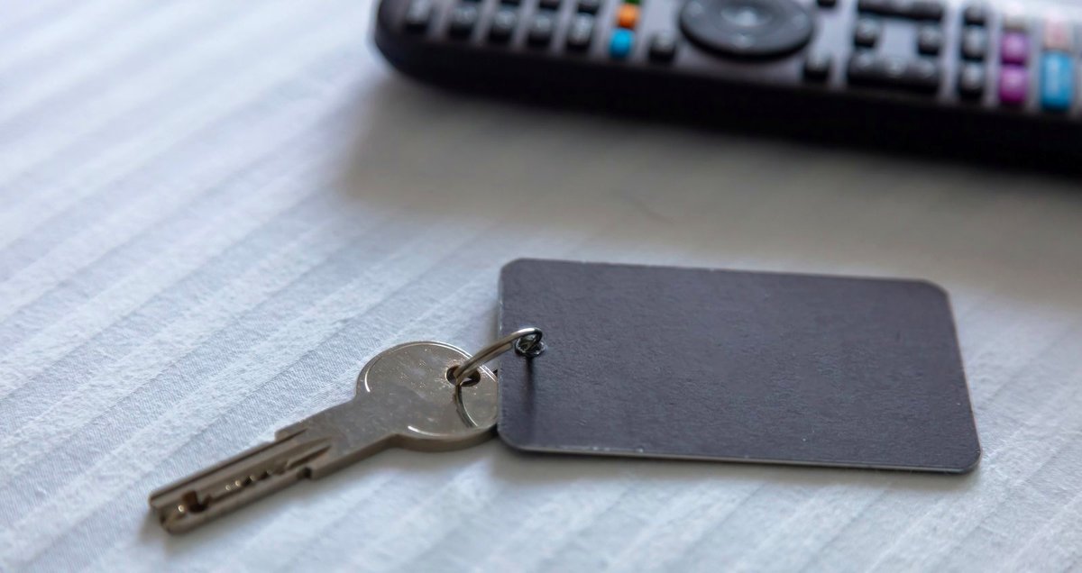 A steel room key with a blank tag